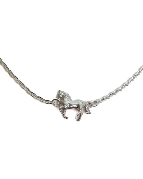 Silver necklace with a horse pendant on a white background