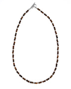 Necklace with brown beads on a white background