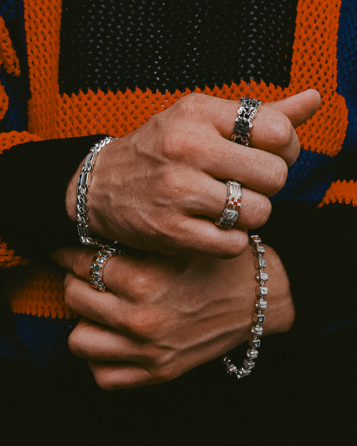 Front and closeup of man's hands wearing MAPLE rings & bracelets