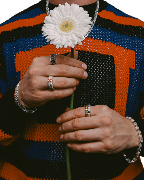 Man holding flower in front his chest wearing MAPLE Romi's Ring (Silver 925/Sapphire)