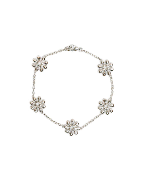 Silver bracelet with sun inspired pendants on a white background