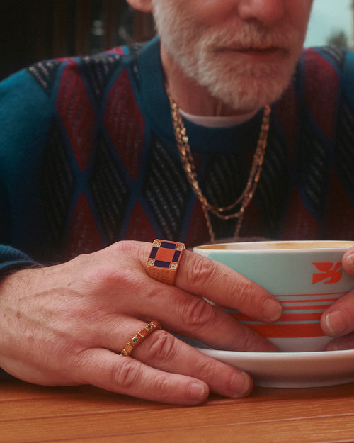 FW24 Editorial closeup of hands holding a latte while wearing MAPLE 14K gold prelude ring & romi ring