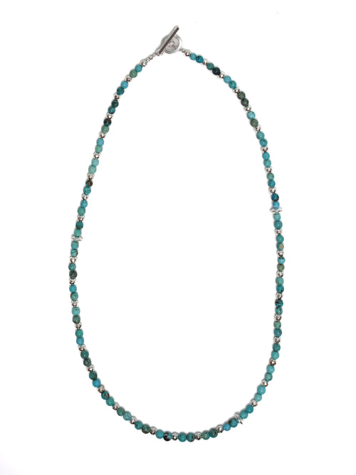 Necklace with blue beads on a white background