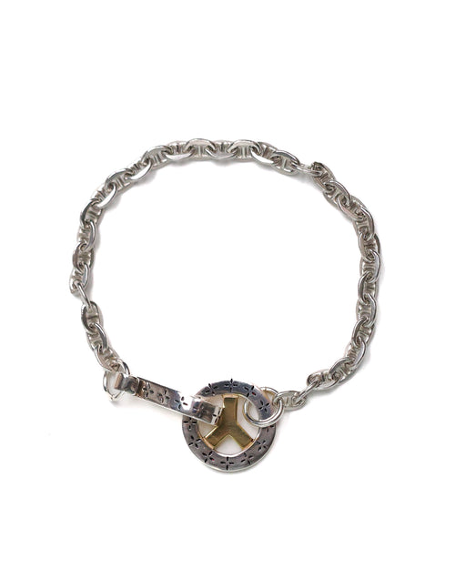 Silver bracelet with a peace symbol charm on a white background