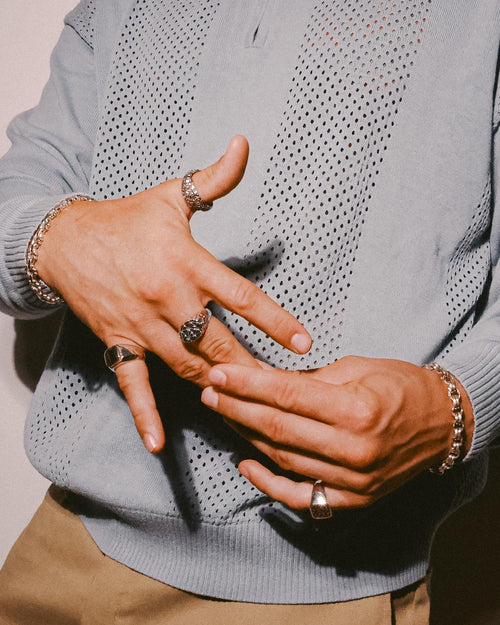 Close up of man's hands adjusting MAPLE rings.